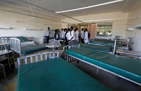 Kenyan student doctors gather inside a deserted labour ward at the Kenyatta National Hospital during a doctors&#039; strike to demand fulfilment of a 2013 agreement between doctors&#039; union and the government that would raise the medical practitioners pay and improve working conditions in Nairobi, Kenya, January 19, 2017.