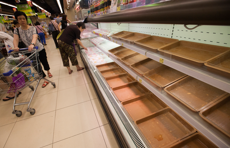A supermarket shelf usually stocked with fish is stripped bare as people panic buy food supplies in preparation for the arrival of Super Typhoon Mangkhut, in a supermarket in Hang Hau, Tseung Kwan O, New Territories, Hong Kong, China, 15 September 2018. Experts say Super Typhoon Mangkhut will be the most powerful tropical storms to hit Hong Kong in decades.