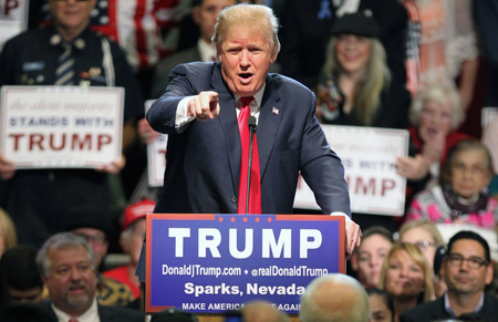 In this Oct. 29, 2015 file photo, Republican presidential candidate Donald Trump in Sparks, Nev. One year before Election Day 2016, Republicans are consumed by uncertainty and infighting while Democrats are coalescing behind Hillary Rodham Clinton. But there&#039;s a long way to go.