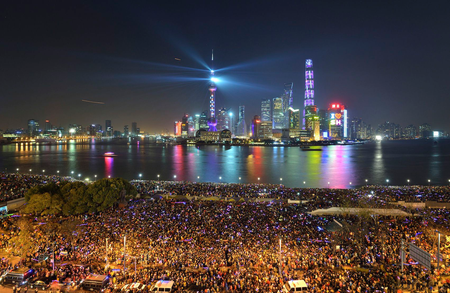 People watch a light show before a stampede incident occurred at the New Year&#039;s celebration on the Bund, a waterfront area in central Shanghai December 31,