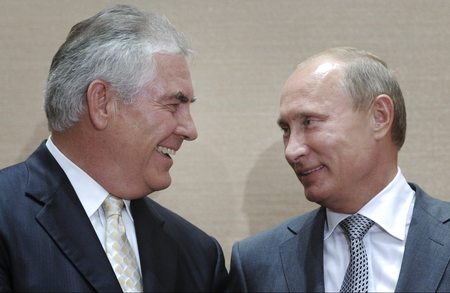 Russian Prime Minister Vladimir Putin, right, and Rex Tillerson, ExxonMobil&#039;s chief executive smile during a signing ceremony in the Black Sea resort of Sochi, Russia, Tuesday, Aug. 30, 2011. Russia&#039;s state-owned Rosneft teamed up with U.S. company ExxonMobil on Tuesday to develop huge offshore oil fields in the Russian Arctic in return for access to resources in the Gulf of Mexico.