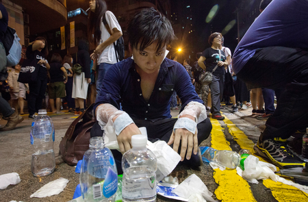 An injured protestor rests on the ground during a demonstration outside the Chinese government&#039;s headquarters in Hong Kong, China, 06 November 2016. Thousands of protestors marched through the streets of Hong Kong to demonstrate against the Chinese government&#039;s controversial decision to decide the fate of two Hong Kong lawmakers who refused to pledge allegiance to the Hong Kong constitution and swore featly to the Hong Kong nation instead. EPA/ALEX HOFFORD