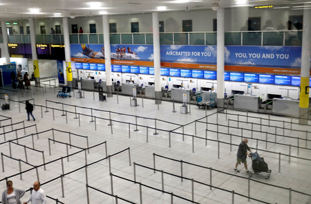 The closed Thomas Cook check-in desks are at the South Terminal of London Gatwick Airport on Sept. 23.