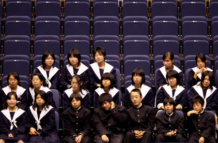 Junior high school students wearing school uniforms watch the fourth phase match of FIVB Volleyball World Cup 2007 in Komaki, Japan