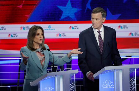 Former Colorado Governor John Hickenlooper watches Marianne Williamson speak at the first round of democratic debates for the 2020 presidential election.