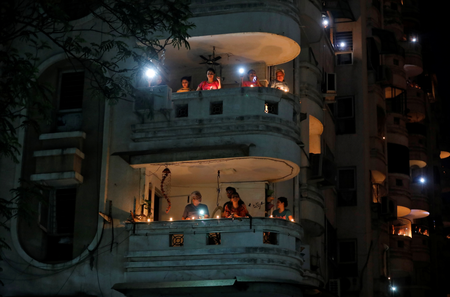 Prime minister Modi had asked Indians to stand in their balconies or their doorways, like these residents in Ahmedabad. Gujarat, did.