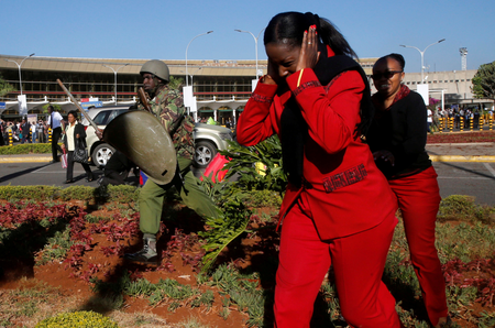 Kenya Airways workers are dispersed by riot police officers at the Jomo Kenyatta International Airport during a labour dispute that grounded flights near Nairobi, Kenya March 6, 2019.