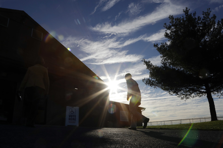 A voters walks to a polling place at the Schnecksville Fire Company, Tuesday, Nov. 8, 2016, in Schnecksville, Pa.