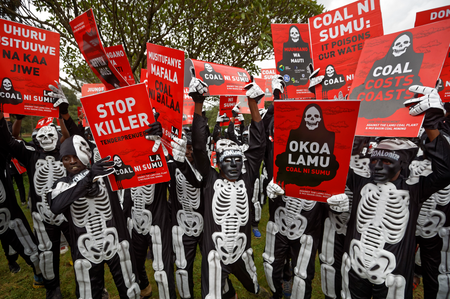 Environmental protesters demonstrate against recent government plans to mine coal and open a coal-fired power plant, in downtown Nairobi, Kenya Tuesday, June 5, 2018. Kenyan activists protested plans for the joint venture between the Kenyan and Chinese governments in Lamu County, saying it will have devastating effect on the environment and health of local populations.