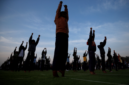 School children attend a yoga session in Ahmedabad