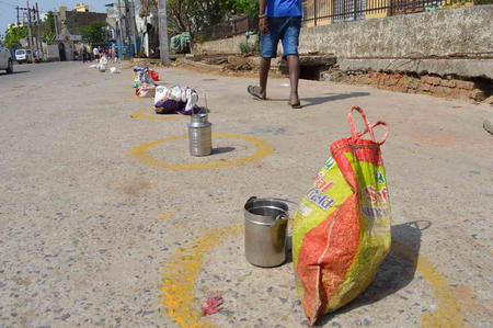 A photograph taken in April 2020 shows bags and utensils placed by migrant workers outside a school in Delhi where the government was distributing rations during the coronavirus lockdown.