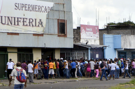 People loot a supermarket in San Felix in the state of Bolivar, Venezuela