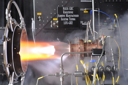 Liquid oxygen/gaseous hydrogen rocket injector assembly built using additive manufacturing technology is hot-fire tested at NASA Glenn Research Center’s Rocket Combustion Laboratory in Cleveland, Ohio.