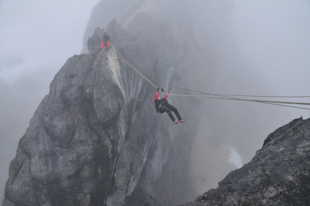 O’Brien on the Tyrolean traverse on route to Carstensz Pyramid summit.