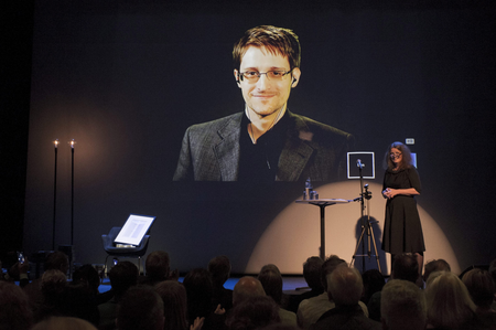 A chair is pictured on stage as former U.S. National Security Agency contractor Edward Snowden is awarded the Bjornson prize in Molde, Norway September 5, 2015. The Norwegian cultural academy awarded the Bjornson prize to Snowden as part of a larger seminar where the main topic is dedicated to the right of privacy, surveillance and monitoring. Pictured right is Hege Newth Nouri, president of the Bjornson Academy.