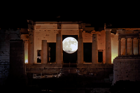 A rising &quot;supermoon&quot; is seen through the Propylaea, the ancient Acropolis hill gateway, in Athens, Greece November 14, 2016.