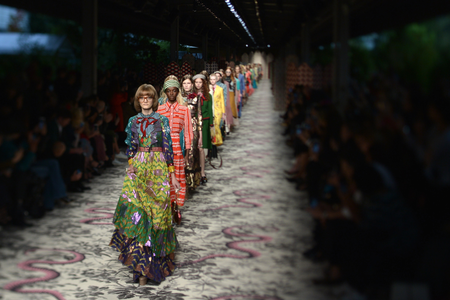 PICTURE TAKEN WITH A TILT AND SHIFT LENS - Models present creations for fashion house Gucci during the women Spring / Summer 2016 Milan&#039;s Fashion Week on September 23, 2015 in Milan. AFP PHOTO / TIZIANA FABI (Photo credit should read TIZIANA FABI/AFP/Getty Images)