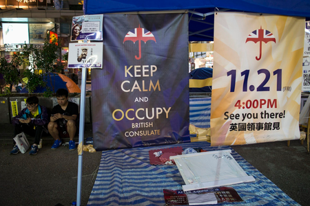 Posters appealing for people to join them for an upcoming protest, are displayed in an area protesters are occupying in Mongkok shopping district in Hong Kong November 10, 2014. Protesters say they are planning a demonstration on