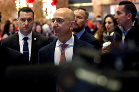 Jeff Bezos, founder, chairman, and chief executive officer of Amazon.com enters Trump Tower ahead of a meeting of technology leaders with President-elect Donald Trump in Manhattan, New York City, U.S., December 14, 2016. REUTERS/Andrew Kelly - RTX2V2Y0