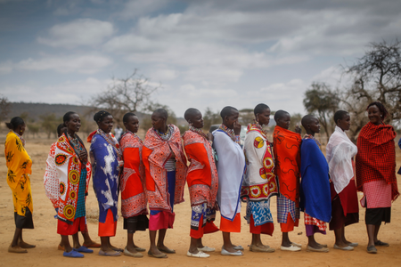 Maasai women wait in line to cast their votes in general elections at a polling station in Iloodokilani in Kajiado County, some 100km south of the capital Nairobi, Kenya.