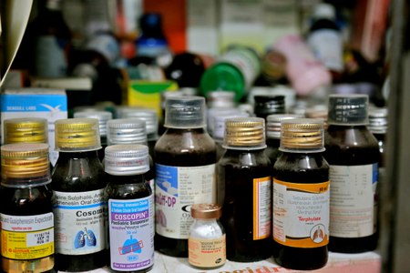 A vial of benzathine penicillin G produced by Pfizer Limited in the medicines&#039; cabinet of a doctor in New Delhi, India.