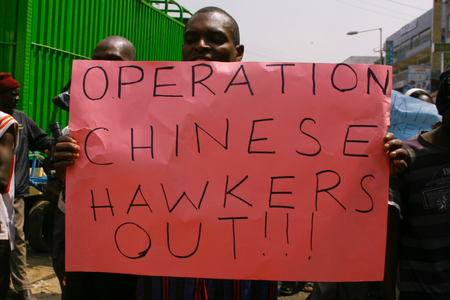 A Kenyan trader holds up a placard during a protest against Chinese hawkers in Nairobi in 2012.