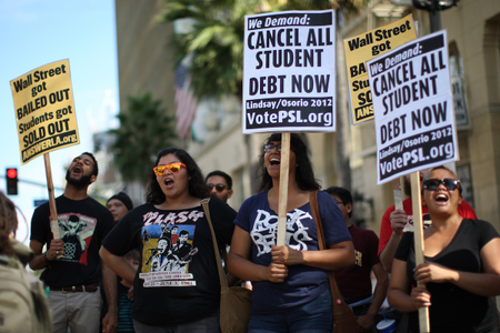 LOS ANGELES, CA - SEPTEMBER 22: Demonstrators burn their student loan bills on the Hollywood Walk of Fame to protest the rising cost of high education on September 22, 2012 in the Hollywood section of Los Angeles, California. (Photo by David McNew/Getty Images)