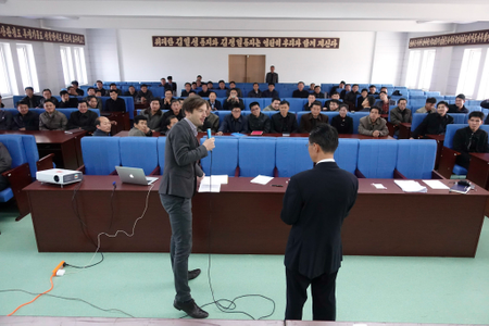 A foreign seminar leader leads a business class in the DPRK.