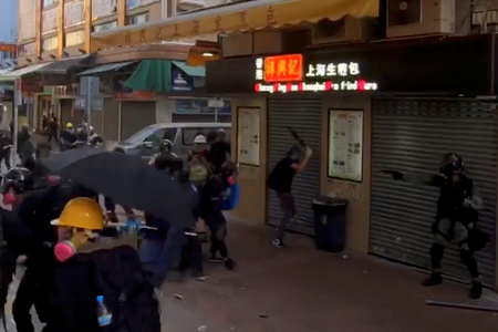 A protester is shot by a police officer in Tsuen Wan Tai Ho Road, Hong Kong, China October 1, 2019 in this still image taken from a social media video.