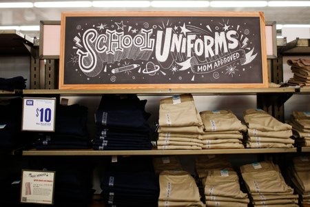 A stack of school uniforms are seen on the shelves inside the Old Navy clothing shop during a &quot;ChildSpree&quot; back-to-school shopping event in San Jose, August 3, 2013. The event, hosted annually by the Salvation Army, provides 100 children in need of economic assistance, $100 each to shop for new clothes in preparation for the upcoming school year, according to a representative from the organization. REUTERS/Stephen Lam (UNITED STATES - Tags: BUSINESS EDUCATION SOCIETY) - GM1E984056J01
