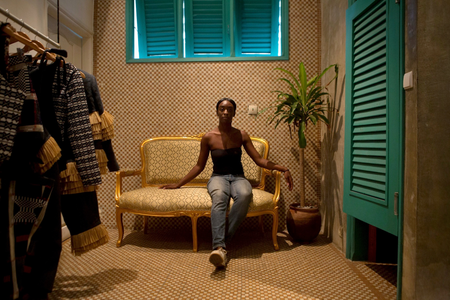 Fashion designer Loza Maleombho sits in the showroom of her clothing line in Abidjan.