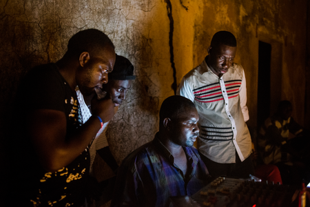 Concert organizers play music in-between performers on May 20, 2017 in Macina, Mali.