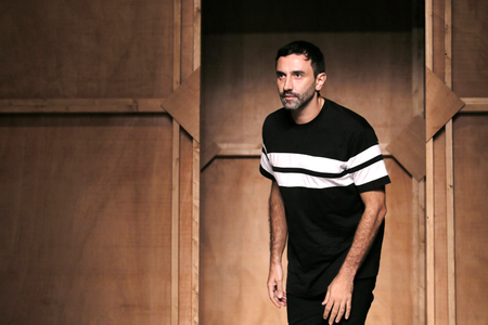 Italian designer Riccardo Tisci appears at the end of his Spring/Summer 2015 women&#039;s ready-to-wear collection for fashion house Givenchy during Paris Fashion Week September 28, 2014. REUTERS/Gonzalo Fuentes (FRANCE - Tags: FASHION ENTERTAINMENT) - RTR482IB