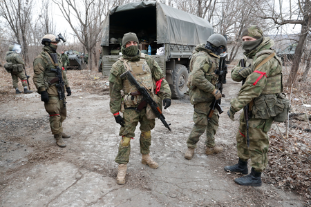 Service members of pro-Russian troops in uniforms without insignia gather in Donetsk region, Ukraine