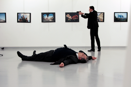Russian Ambassador to Turkey Andrei Karlov lies on the ground after he was shot by Mevlut Mert Altintas at an art gallery in Ankara, Turkey on Dec.19,2016.