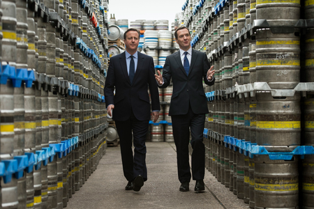 Britain&#039;s Prime Minister and Conservative Party leader David Cameron (L) walks with Chancellor George Osborne during their visit to Marston&#039;s Brewery in Wolverhampton, central England April 1, 2015. Britain will go to the polls in a national election on May 7.