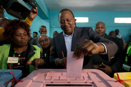 epa06131543 Kenya?s incumbent President and the leader of the ruling Jubilee coalition, Uhuru Kenyatta (C), casts his ballot at a polling station in his traditional home, Gatundu, some 60km north of the capital Nairobi, Kenya, 08 August 2017. Kenyans are casting their votes to elect their leaders in general elections where Kenyatta is being challenged by the popular opposition leader Raila Odinga who leads The National Super Alliance (NASA) coalition. Many fear the possibility of post-election violence.