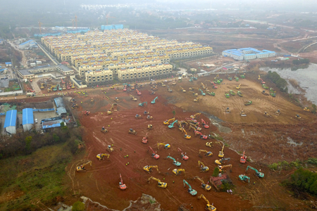 Excavators and bulldozers are seen at the construction site where the new hospital is being built to treat patients of a new coronavirus, following the outbreak and the city&#039;s lockdown, on the outskirts of Wuhan, China January 24, 2020. Picture taken January 24, 2020. cnsphoto via REUTERS. ATTENTION EDITORS - THIS IMAGE WAS PROVIDED BY A THIRD PARTY. CHINA OUT. TPX IMAGES OF THE DAY - RC2ZME9BEMUS
