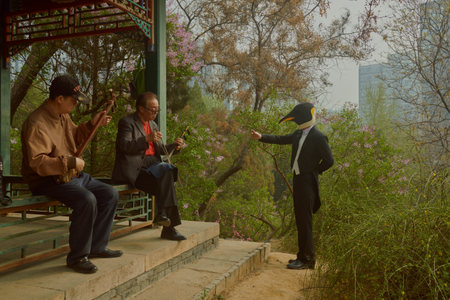 This corner in a park says a lot about China, Xu said. It shows a typical daily routine of a retired man, who visits a park and sings Beijing opera while playing an urhu, a traditional string instrument, inside a pavilion. There&#039;s a skyscraper in the distance.