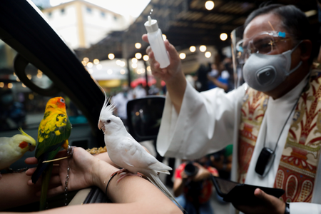 A pet receives a drive-thru Catholic blessing on World Animal Day in the Philippines in October.