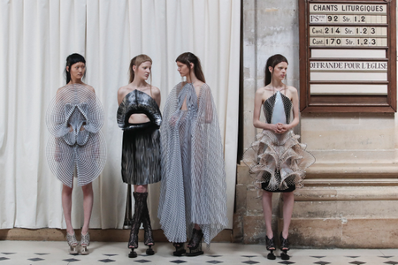 Models wait before the show, as they wear creations for Iris Van Herpen&#039;s Haute Couture Fall-Winter 2016-2017 collection presented Monday, July 4, 2016 in Paris. (AP Photo/Kamil Zihnioglu)
