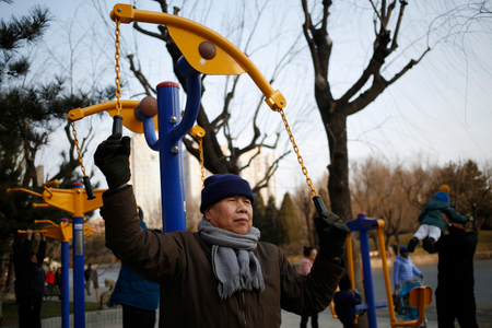 A Chinese elderly man exercising in a park on a clear day after the end of a long orange alert for smog in Beijing, China, 08 January 2017. People came out in droves to enjoy clean air and clear skies in Beijing after the end of an orange alert for heavy air pollution which lasted seven days, beginning on 02 January 2017. EPA/HOW HWEE YOUNG