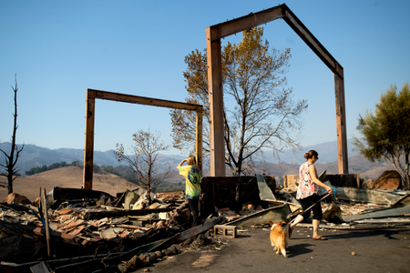Stephanie LaFranchi, right, and Ashley LaFranchi examine the remains of their family&#039;s Oak Ridge Angus ranch, leveled by the Kincade Fire, in Calistoga on Oct. 28.