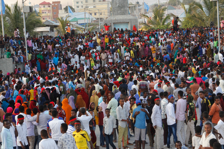 Protesters march near the scene of Saturday&#039;s massive truck bomb attack in Mogadishu, Somalia.