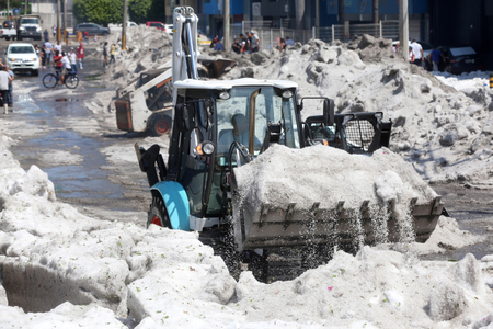 A truck carries ice as it cleans the street after a heavy storm of rain and hail which affected some areas of the city in Guadalajara, Mexico