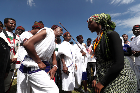 An Ethiopian couple dance as they take part in the Irreecha celebration, the Oromo People thanksgiving ceremony in Addis Ababa, Ethiopia. October 5, 2019.