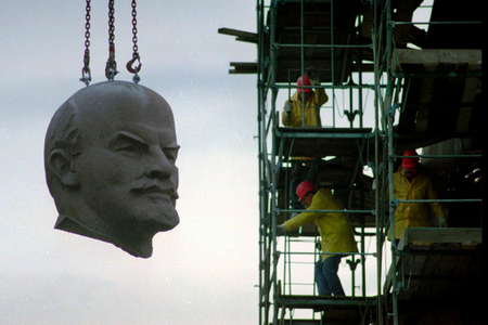 A statue of Lenin being dismantled in Berlin in 1991