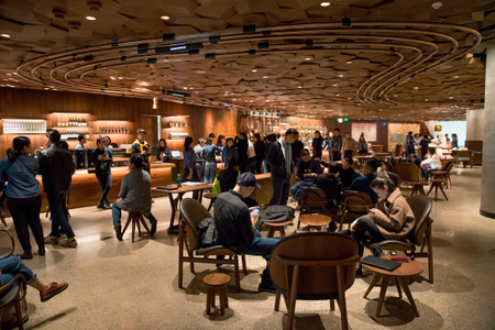 People gather in the new Starbucks Roastery in Shanghai, China.