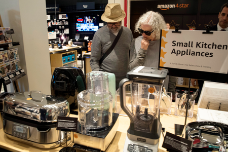 Shoppers browse a selection of kitchen appliances on display at the Amazon 4-star store in New York