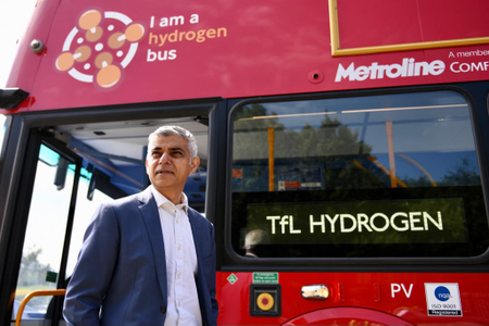 London mayor Sadiq Kahn stands in front of a hydrogen fuel cell bus